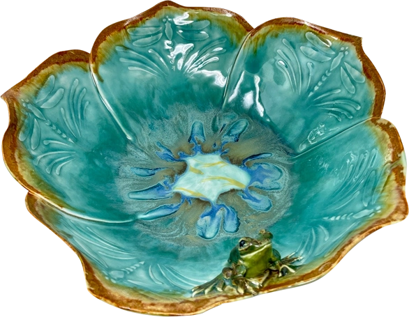 A blue bowl with a frog on it