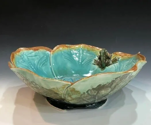 A bowl with a plant inside of it